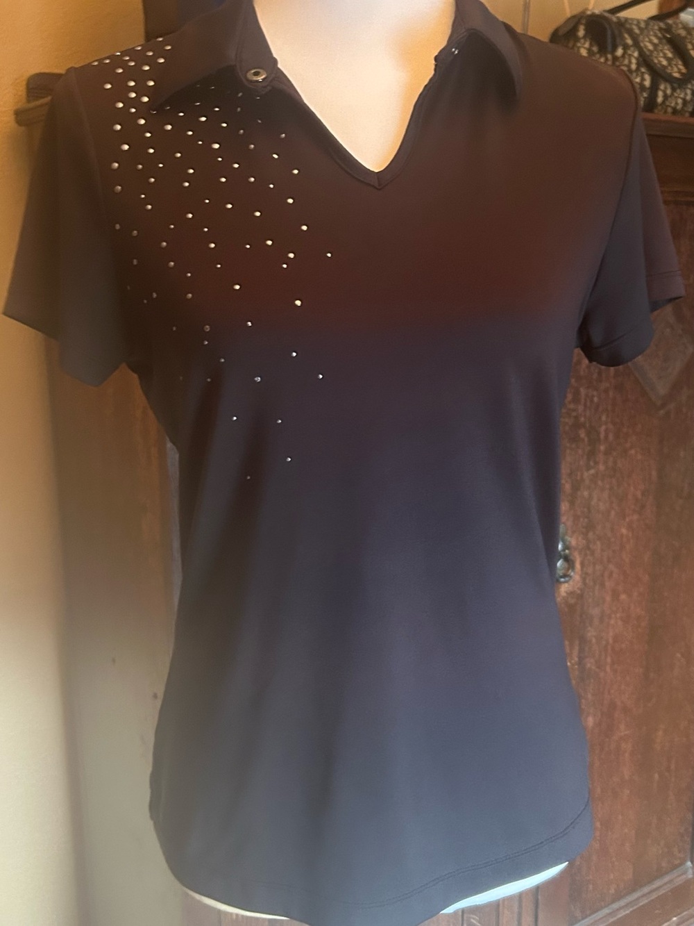 Tail pickleball, golf or tennis shirt.